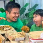 Louie, a dad in his early 40s, sitting his son Luis eating pizza & chicken — a real moment of presence from the LifeSharesTogether family